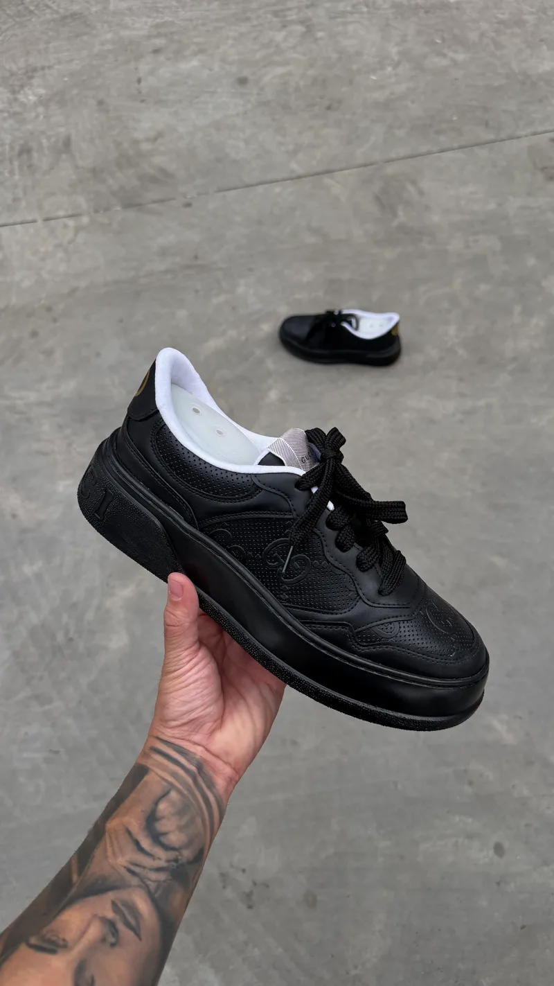 Gucci Supreme black gold